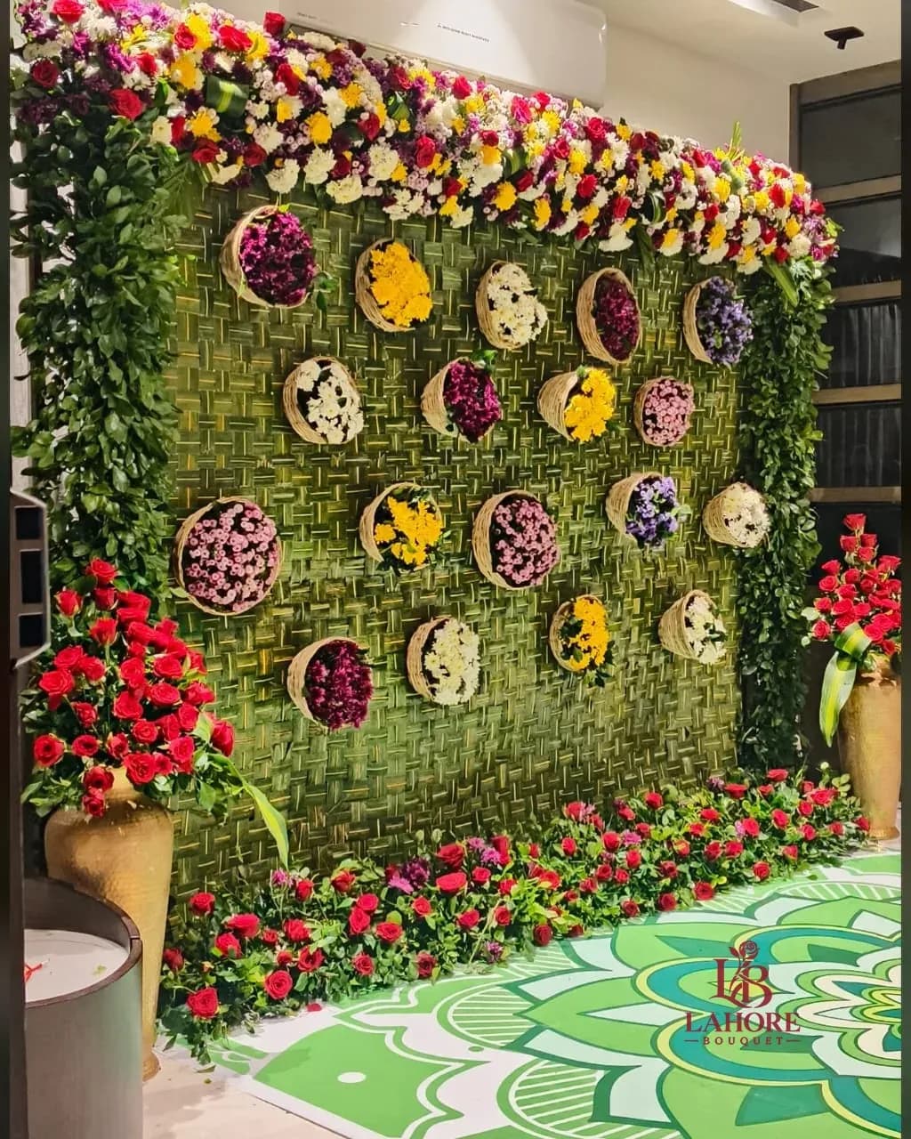 Green Wall Backdrop with Basket Flowers