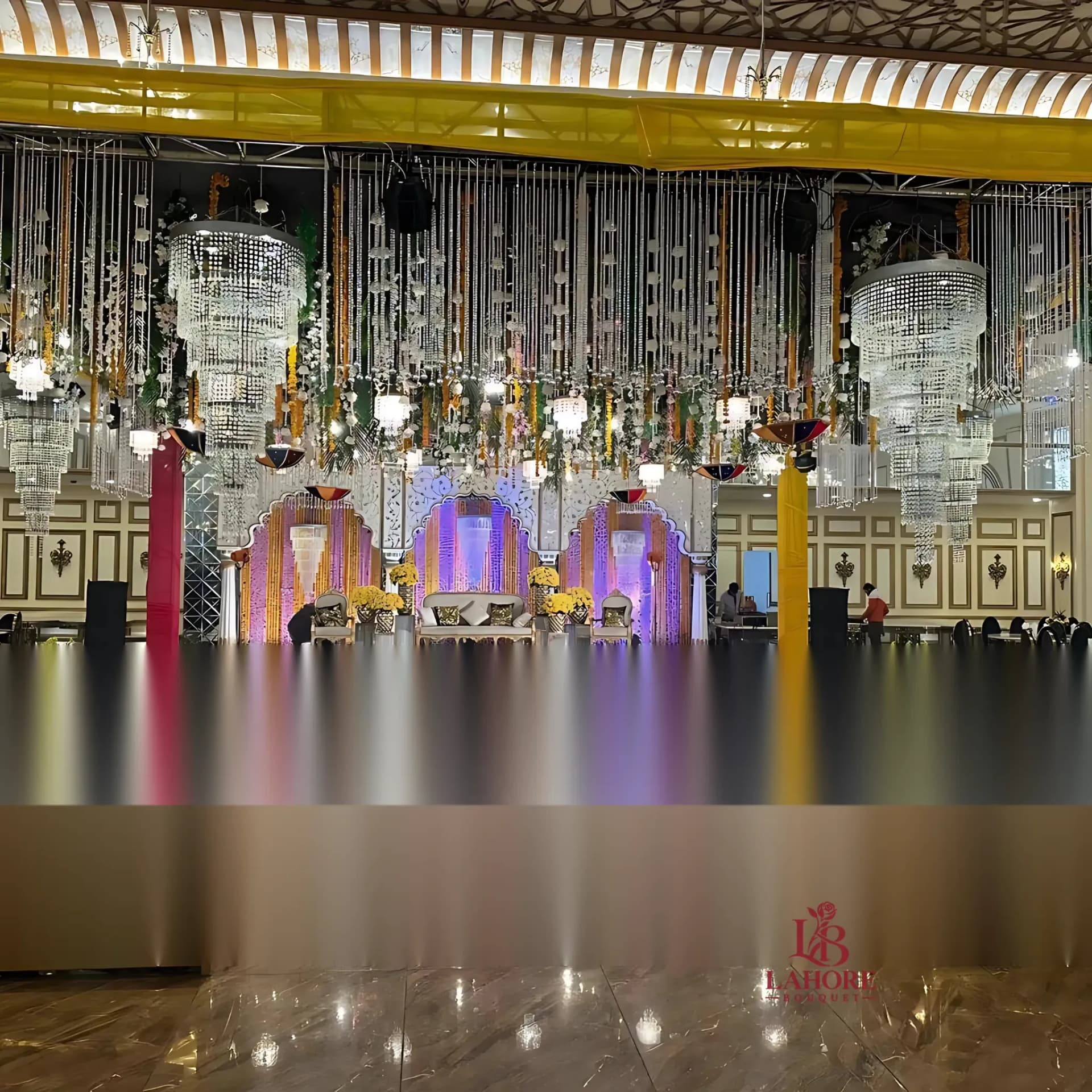 Grand Royal Wedding Stage – Crystal Chandeliers & Vibrant Floral Accents